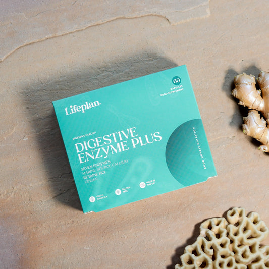 Lifeplan Digestive Enzyme Plus supplement package on a textured surface with ginger root.